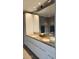 Bathroom featuring double sinks, granite countertops, and sleek white cabinetry at 7147 E Rancho Vista Dr # 7004, Scottsdale, AZ 85251