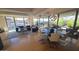 Bright living and dining area with wood floors, modern lighting, and large windows overlooking the community gardens at 7147 E Rancho Vista Dr # 7004, Scottsdale, AZ 85251