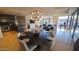 Open concept living space with modern lighting fixtures and dining area with natural light from large windows at 7147 E Rancho Vista Dr # 7004, Scottsdale, AZ 85251