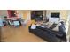 Spacious living area featuring a sleek black leather sofa and an open layout to the dining area and kitchen at 7147 E Rancho Vista Dr # 7004, Scottsdale, AZ 85251