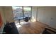 Modern office space featuring hardwood floors, a large window with a view, and a modern black desk at 7147 E Rancho Vista Dr # 7004, Scottsdale, AZ 85251