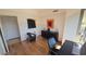 Bright office space featuring hardwood floors, black desk and credenza, and modern decor at 7147 E Rancho Vista Dr # 7004, Scottsdale, AZ 85251