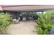 Inviting outdoor patio with comfortable seating surrounded by mature trees and bushes at 7147 E Rancho Vista Dr # 7004, Scottsdale, AZ 85251