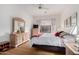 Comfortable bedroom featuring wood floors, light walls, and neutral furnishings at 7195 E Canyon Wren Dr, Gold Canyon, AZ 85118