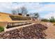 Beautiful Mountainbrook Village entrance featuring a water feature and desert landscaping at 7195 E Canyon Wren Dr, Gold Canyon, AZ 85118