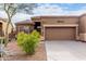 Charming single-story home with a well-maintained desert landscape and a two-car garage at 7195 E Canyon Wren Dr, Gold Canyon, AZ 85118