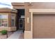 Beautiful home featuring an entryway with a security door and desert-style landscape at 7195 E Canyon Wren Dr, Gold Canyon, AZ 85118