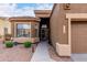 Inviting desert home featuring an entryway with a security door and desert-style landscape at 7195 E Canyon Wren Dr, Gold Canyon, AZ 85118