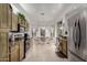 Bright eat-in kitchen with stainless appliances, tile flooring, and neutral color palette at 7195 E Canyon Wren Dr, Gold Canyon, AZ 85118