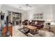 Spacious living room with tile flooring, ceiling fan, and sliding glass doors to the backyard patio at 7195 E Canyon Wren Dr, Gold Canyon, AZ 85118