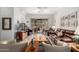 Bright living room with tile flooring, a ceiling fan, and sliding glass doors leading to the backyard at 7195 E Canyon Wren Dr, Gold Canyon, AZ 85118