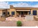 Inviting outdoor patio featuring an outdoor kitchen and dining set, perfect for entertaining at 7195 E Canyon Wren Dr, Gold Canyon, AZ 85118