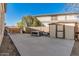 Large concrete backyard with storage shed, AC unit, and view of home's solar panels at 7531 W Rock Springs Dr, Peoria, AZ 85383