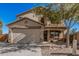 Charming two-story home with a cozy front porch, perfect for enjoying sunny days and neighborhood views at 7531 W Rock Springs Dr, Peoria, AZ 85383