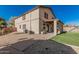 Back exterior view of home featuring covered porch and artificial turf at 7531 W Rock Springs Dr, Peoria, AZ 85383