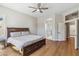 Spacious main bedroom featuring a hardwood floor and an ensuite bathroom with dual sinks and a shower at 7919 E Posada Ave, Mesa, AZ 85212