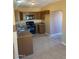 A kitchen featuring brown cabinets, granite countertops, and a tile floor at 813 N Trekell Rd, Casa Grande, AZ 85122