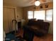 Spare bedroom with a desk, futon, ceiling fan, and two windows at 8600 E Broadway Rd # 22, Mesa, AZ 85208