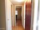 Hallway with multiple doors and wood floors at 8600 E Broadway Rd # 22, Mesa, AZ 85208