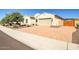 Charming single-story home showcasing a well-manicured front yard, spacious driveway and a two-car garage at 9336 W Louise Dr, Peoria, AZ 85383