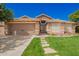 Charming single-story home featuring desert landscaping, stone accents, and a two-car garage at 9420 E Plata Ave, Mesa, AZ 85212