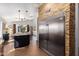 Bright kitchen featuring stainless steel refrigerator, large island, and views to the dining area at 9420 E Plata Ave, Mesa, AZ 85212