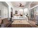 Comfortable living room featuring tile floors, tray ceiling, and sliding glass doors at 9420 E Plata Ave, Mesa, AZ 85212