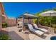 Outdoor patio featuring a gazebo, seating, built-in grill, and lounge chairs at 9420 E Plata Ave, Mesa, AZ 85212