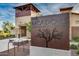 Close up of 'The Meadows Community Center' sign, with a stone-accented building in background at 9742 W Los Gatos Dr, Peoria, AZ 85383