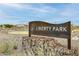 Community sign for Liberty Park, highlighting the neighborhood's name and inviting atmosphere at 9742 W Los Gatos Dr, Peoria, AZ 85383