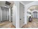 Hallway showcasing arched doorways and neutral paint, creating a welcoming transition between rooms at 9742 W Los Gatos Dr, Peoria, AZ 85383