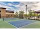 Outdoor pickleball court with green and blue surface and black net, surrounded by landscaping near the community center at 9742 W Los Gatos Dr, Peoria, AZ 85383