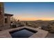 Backyard features a spa with desert mountain views, covered patio with plenty of room for seating at 9904 E Lookout Mountain Dr, Scottsdale, AZ 85262