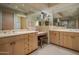 Bathroom featuring double vanity, large mirrors, and plenty of counter space at 9904 E Lookout Mountain Dr, Scottsdale, AZ 85262