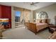 Bedroom with a sliding glass door to balcony and natural light with desert views at 9904 E Lookout Mountain Dr, Scottsdale, AZ 85262