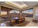 Dining room with scenic mountain views and access to outdoor seating area at 9904 E Lookout Mountain Dr, Scottsdale, AZ 85262