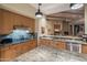 Open concept kitchen with stainless appliances, granite countertops, and view into the dining area at 9904 E Lookout Mountain Dr, Scottsdale, AZ 85262