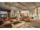 Open-concept living room with wood-beamed ceilings and a seamless flow to the kitchen at 9904 E Lookout Mountain Dr, Scottsdale, AZ 85262