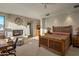 Bright main bedroom featuring a fireplace, seating area, and natural light at 9904 E Lookout Mountain Dr, Scottsdale, AZ 85262