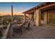 Patio with covered area, BBQ, chairs and a desert view at 9904 E Lookout Mountain Dr, Scottsdale, AZ 85262