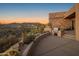 Patio featuring desert landscaping, built in grill, and beautiful desert sunset views at 9904 E Lookout Mountain Dr, Scottsdale, AZ 85262