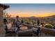 Outdoor patio seating area with desert views, cacti, and desert landscaping at 9904 E Lookout Mountain Dr, Scottsdale, AZ 85262