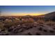 Scenic sunset view overlooking the illuminated city and desert landscape at 9904 E Lookout Mountain Dr, Scottsdale, AZ 85262