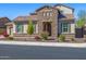 Charming single-Gathering home featuring a stone facade and landscaped front yard at 10110 W El Cortez Pl, Peoria, AZ 85383
