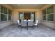 Inviting outdoor patio with a dining set, offering an ideal space for meals and gatherings with access to the house at 10110 W El Cortez Pl, Peoria, AZ 85383