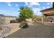 Spacious backyard featuring desert landscaping and mature trees at 10588 E Tierra Buena Ln, Scottsdale, AZ 85255