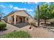 Expansive backyard with desert landscaping, covered patio, and mature trees at 10588 E Tierra Buena Ln, Scottsdale, AZ 85255