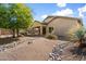 Backyard with desert landscaping, patio, and beautiful desert trees at 10588 E Tierra Buena Ln, Scottsdale, AZ 85255