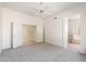 Bright bedroom featuring a ceiling fan and plush carpet at 10588 E Tierra Buena Ln, Scottsdale, AZ 85255