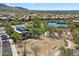 Aerial view of the pool, basketball, and tennis courts with desert landscaping in a planned community at 10588 E Tierra Buena Ln, Scottsdale, AZ 85255